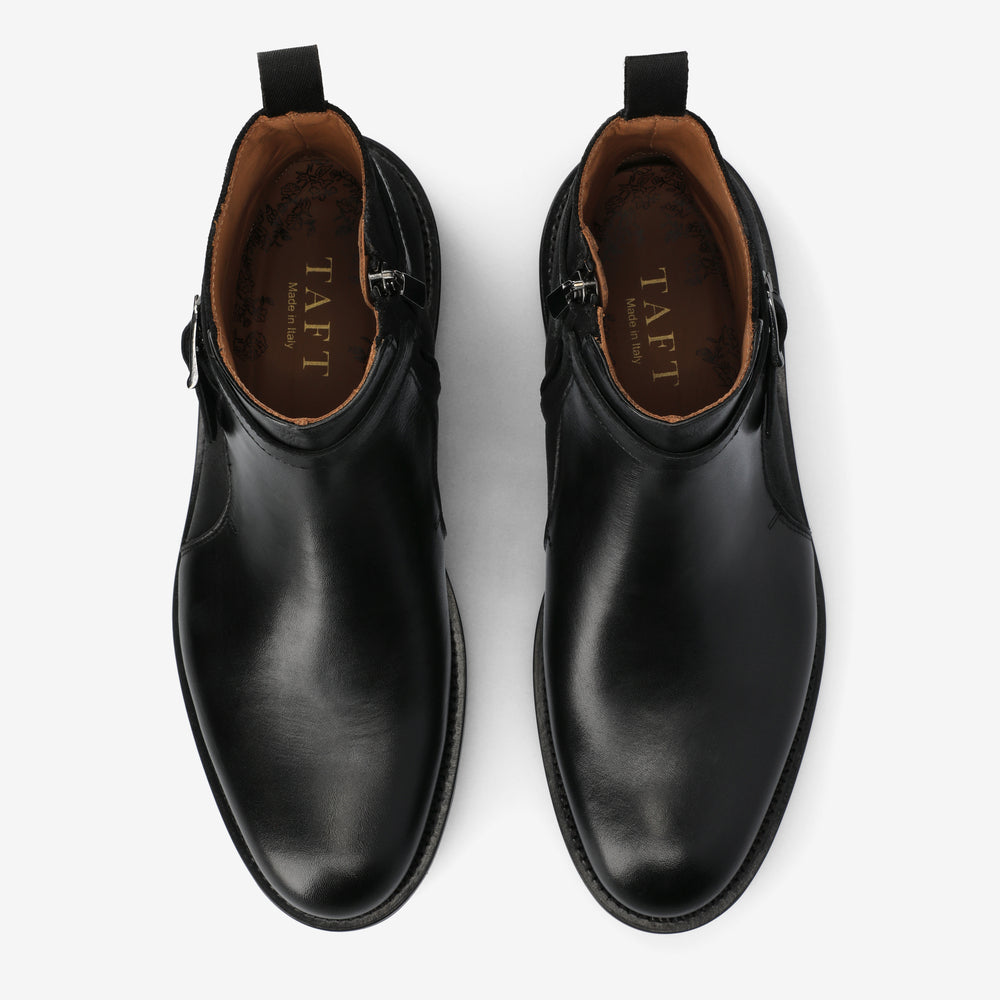 Pair of black leather boots with 'TAFT' branding on a white background