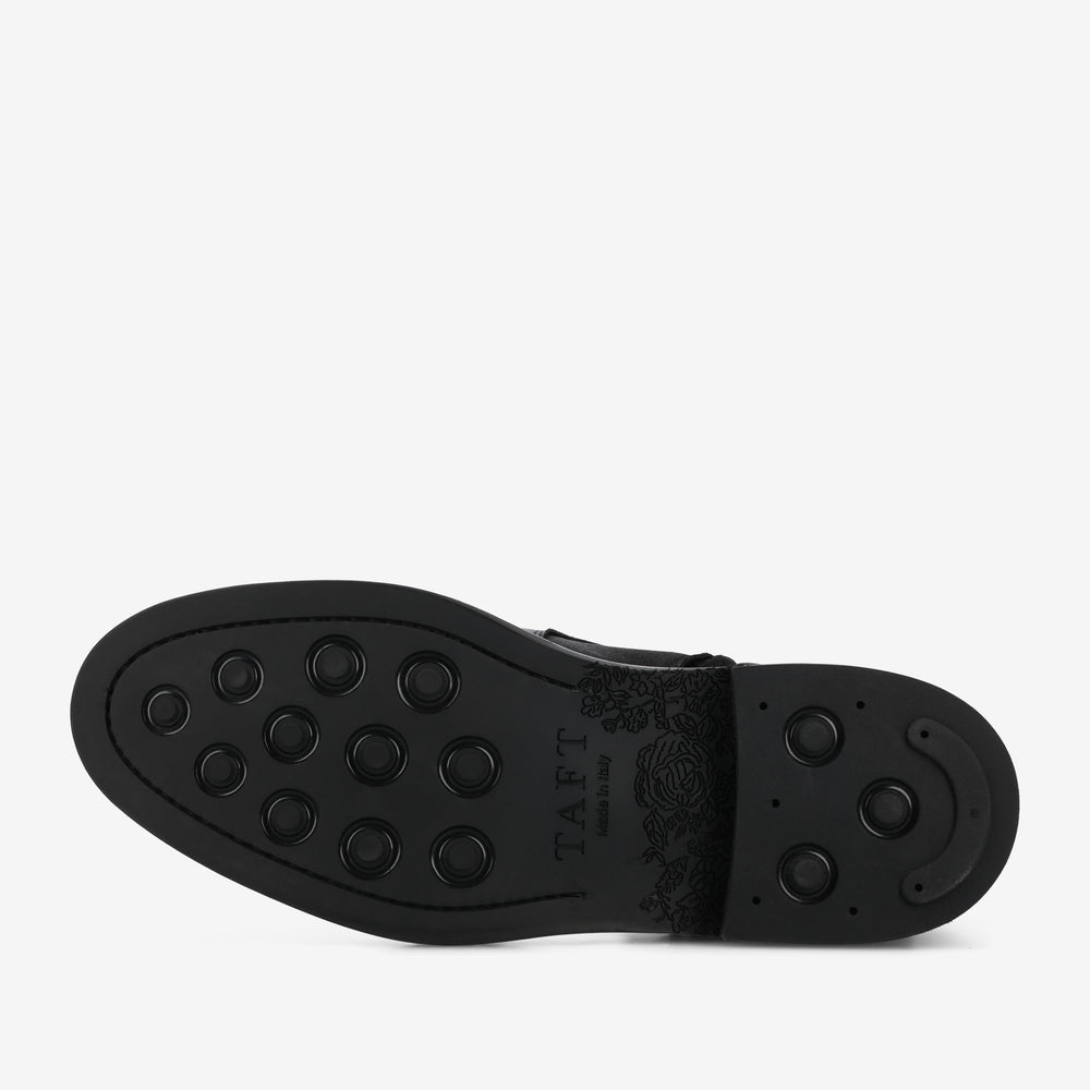 Black shoe sole with brand name 'TAFT' on a white background