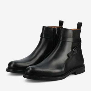Pair of mid height black boots with simple side buckle