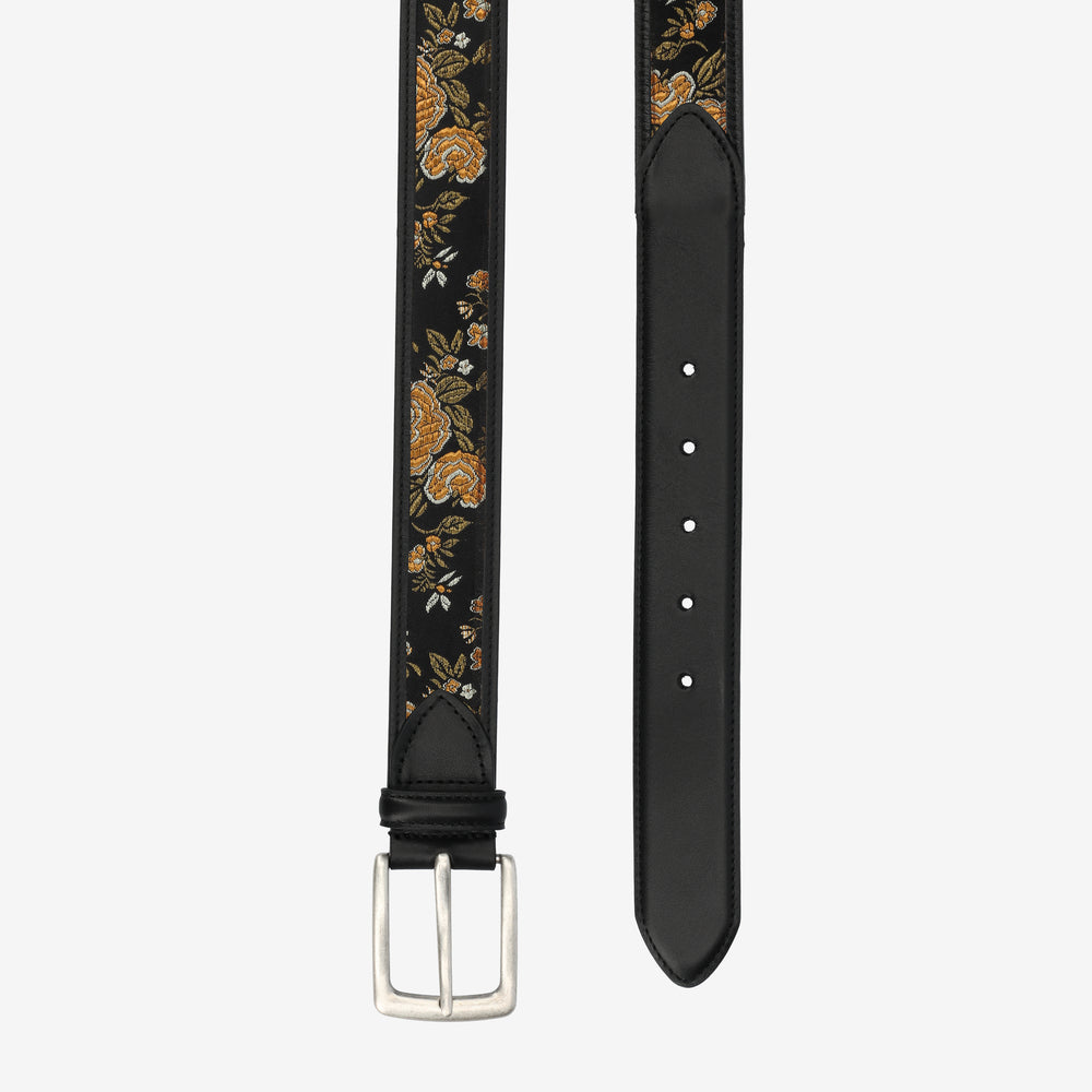 Black belt with floral pattern on a white background
