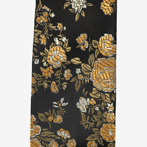 Floral patterned tie with yellow flowers on a black background